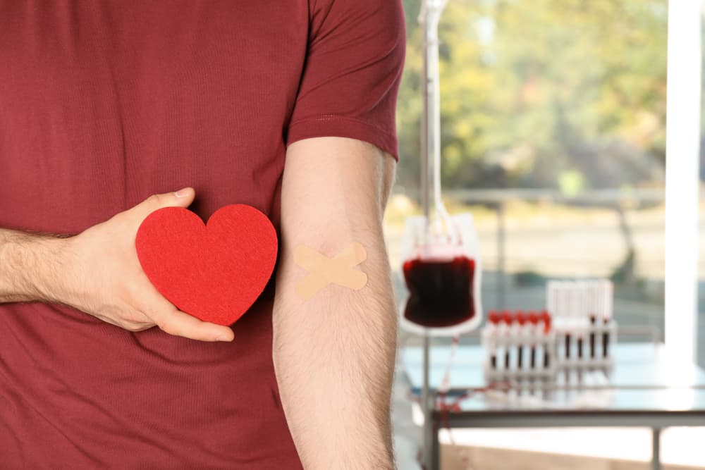 Man,Holding,Heart,Near,Hand,With,Adhesive,Plasters,At,Hospital,