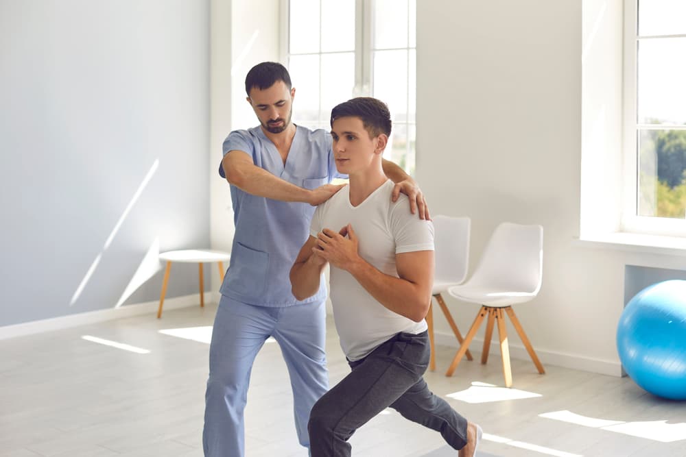 Medical,Center,Specialist,Helping,Young,Man,Recover,After,Trauma.,Professional