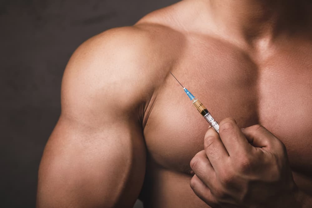 Muscular,Man,With,A,Syringe,In,His,Hand.,Concept,Of