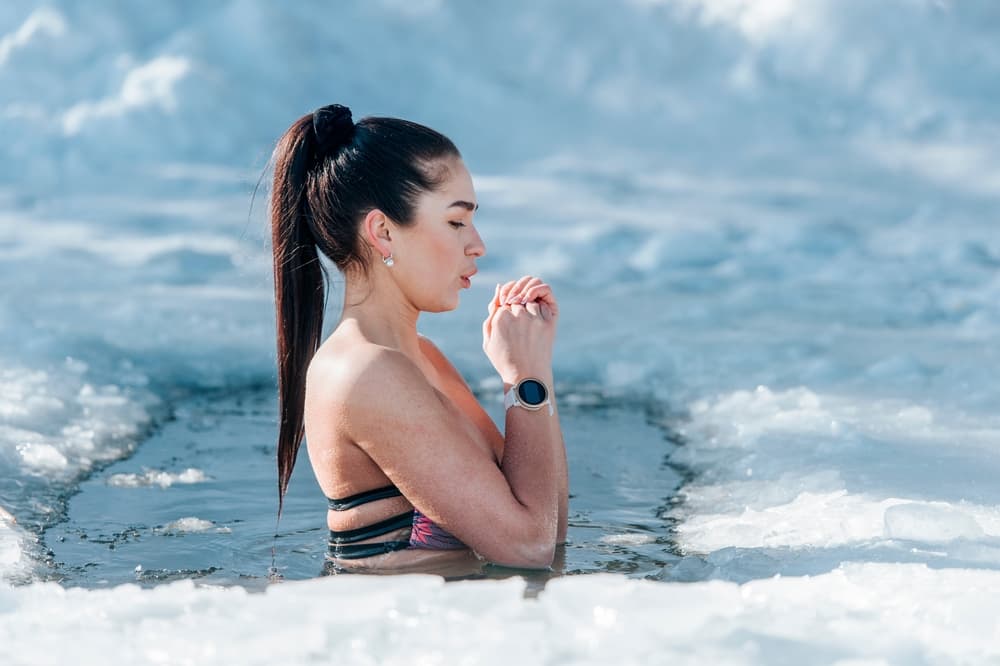 Girl,With,Bikini,And,A,Watch,In,Frozen,Lake,Ice