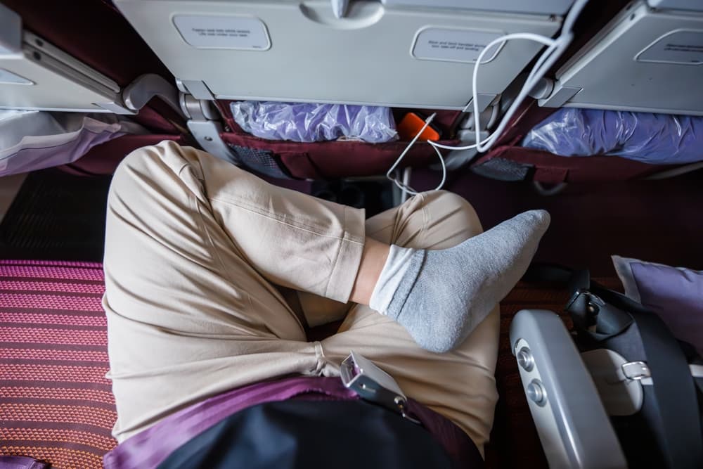 The,Legs,Of,A,Male,Passenger,,Comfortably,Seated,Cross-legged,,Provide
