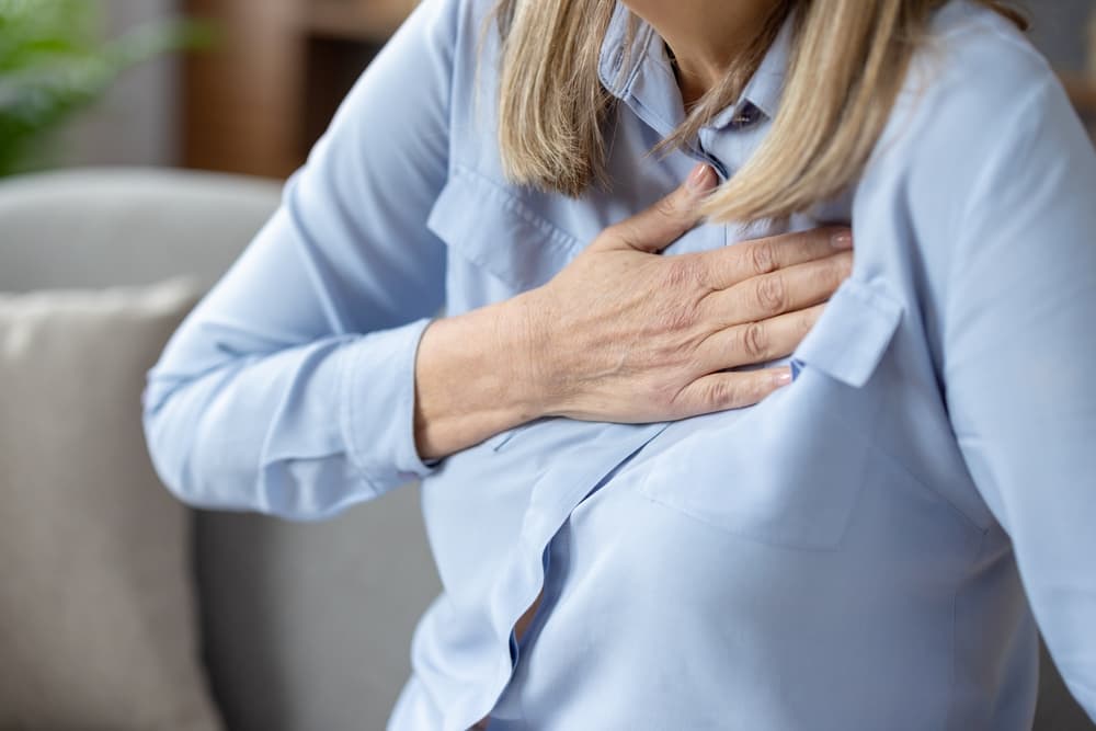 Close-up,Image,Of,A,Senior,Woman,Experiencing,Discomfort,And,Holding