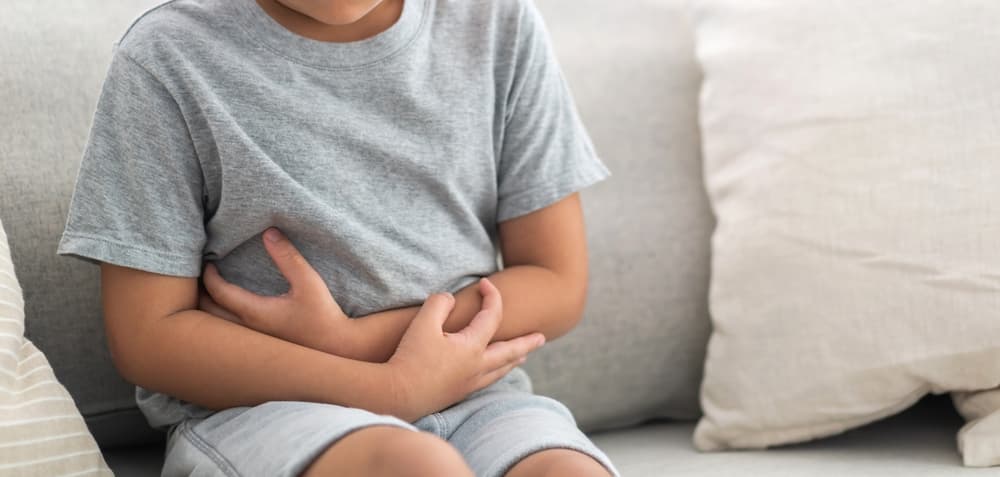 Portrait,Of,Sick,Unhappy,Little,Child,Asian,Boy,Touching,Belly