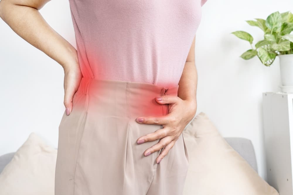 Woman,Suffering,From,Back,Pain,And,Stomach,Pain,During,Menstrual