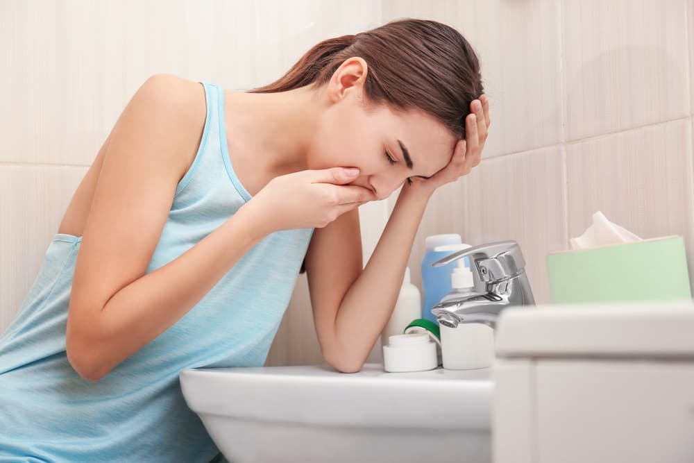 Young,Vomiting,Woman,Near,Sink,In,Bathroom