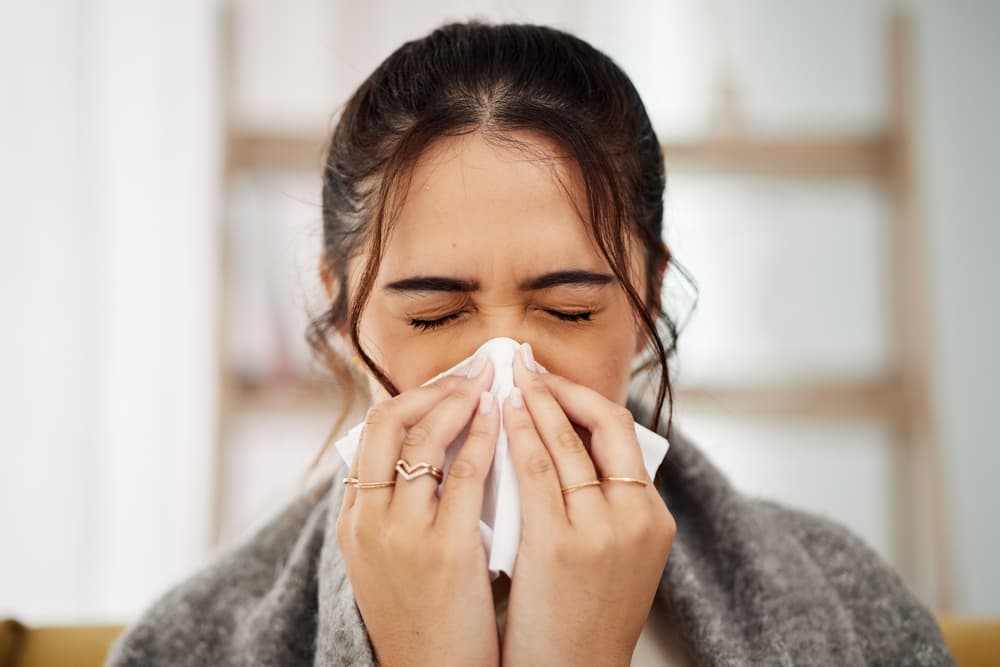 Tissue,,Nose,And,Sick,Woman,Sneezing,In,Living,Room,With